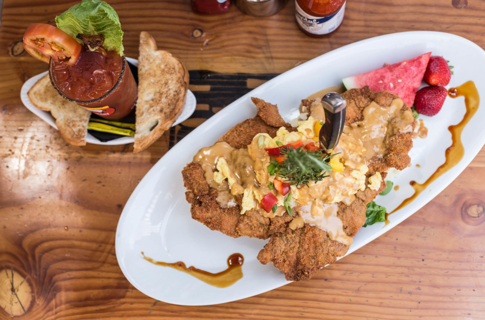 A massive plate of sage fried chicken and waffles, a signature dish at Hash House A Go Go.