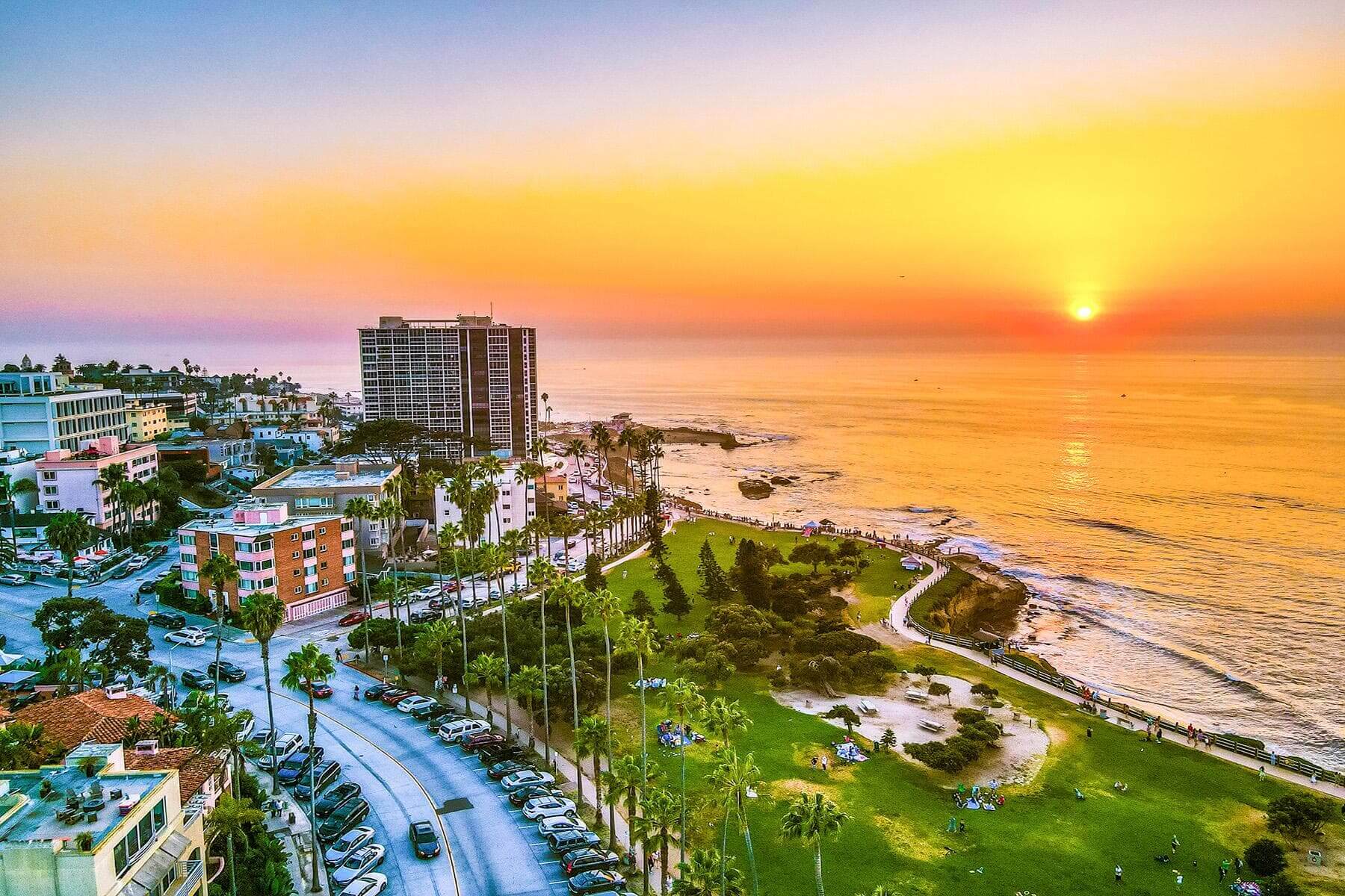 San Diego marina and downtown skyline at a warm, vibrant sunset.