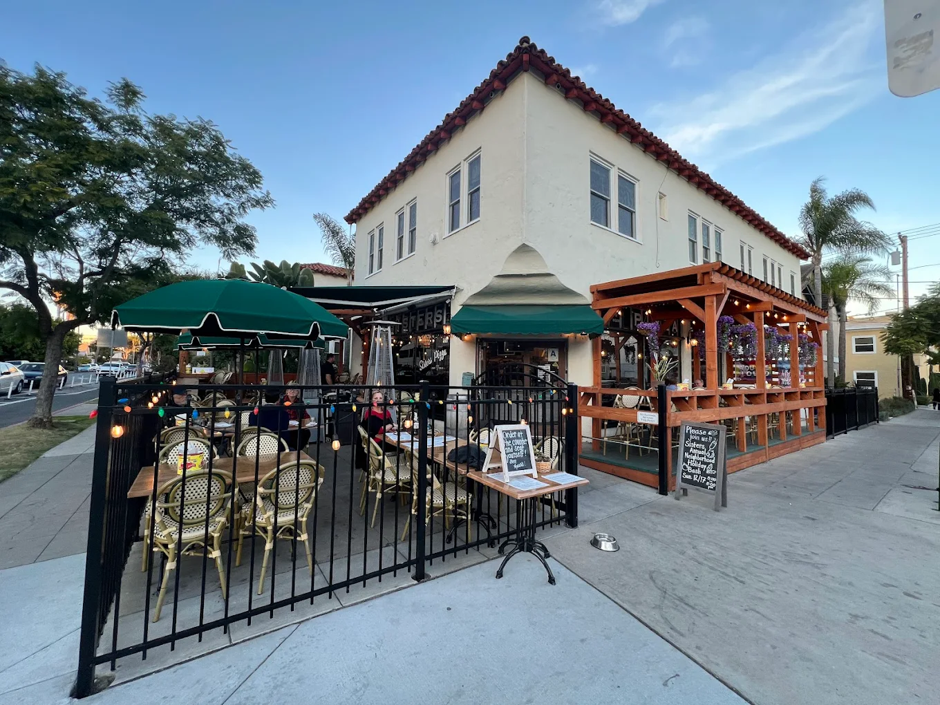 A delicious-looking slice of pizza on a plate at Sisters Pizza in Hillcrest